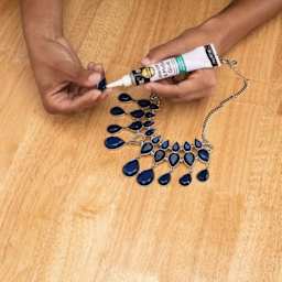 Aleene's Jewelry & Metal Glue, glue being used to adhere jewelry. 