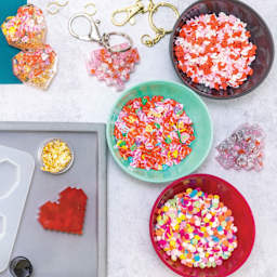 Jewelry Made By Me Polymer Clay Inclusions - Hearts beside other polymer clay inlcusions in seperate dishes