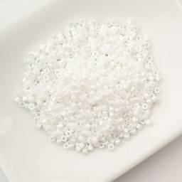 John Bead Cylin 11/0 Cylindrical Seed Beads - White Pearl AB sitting in dish