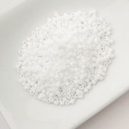 John Bead Cylin 11/0 Matte Macaron Cylindrical Seed Beads - White sitting in dish