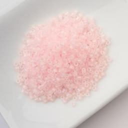 John Bead Cylin 11/0 Matte Macaron Cylindrical Seed Beads - Light Pink AB sitting in dish