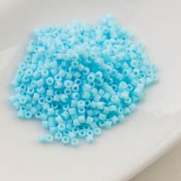 John Bead Cylin 11/0 Matte Macaron Cylindrical Seed Beads - Light Blue sitting in dish