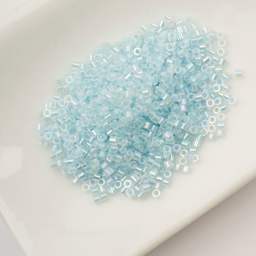 John Bead Cylin 11/0 Glow in the Dark Cylindrical Seed Beads - Sky AB, 25g sitting in dish