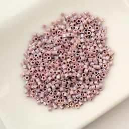 John Bead Cylin 11/0 Cylindrical Seed Beads - Light Lilac AB sitting in dish