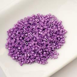 John Bead Cylin 11/0 Cylindrical Seed Beads - Violet Opaque sitting in dish