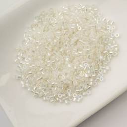 John Bead Cylin 11/0 Glow in the Dark Cylindrical Seed Beads - White to Green AB, 25g sitting in dish