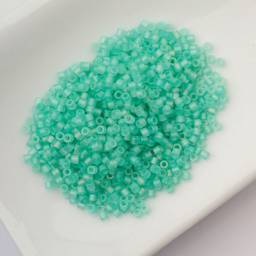 John Bead Cylin 11/0 Matte Macaron Cylindrical Seed Beads - Green Turquoise AB sitting in dish