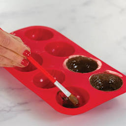 Handstand Kitchen I Heart Cocoa Bombs Silicone Mold (Applying melted chocolate inside mold)