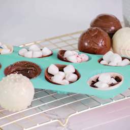 Handstand Kitchen Ultimate Hot Cocoa Bomb Set (Opened cocoa bombs on tray)