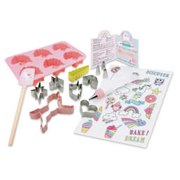 Handstand Kitchen Ultimate Baking Party Set - Rainbows and Unicorns, bakeware and recipe book laid out. 