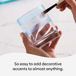 Cricut Joy Smart Stencil Film applied to a glass and a brush applying etching medium.