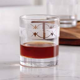 Glass with etched design that was created with Cricut Joy Smart Stencil Film