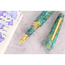 Esterbrook Estie Fountain Pen - Sea Glass, Medium Nib, uncapped with notebook