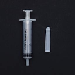 Private Reserve Ink Essentials Standard Kit 1, single syringe and cartridge against black background