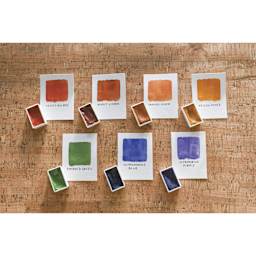 Natural Earth Paint Natural Watercolor Kit - paint pans beside painted color swatches