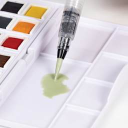 Derwent Line and Wash Paint Pan Set - Set of 12, Assorted Colors, mixing colors on mixing area of the case