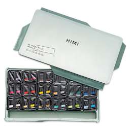 Set with lid off showing pots of paint.