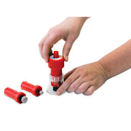 Logan Cos-Tools Hole Drill, in hand demonstrating usage of the drill next to drill tips 