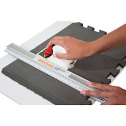 Logan Cos-Tools V-Groove Cutter, in hand cutting foarm board with a straight edge (not included)