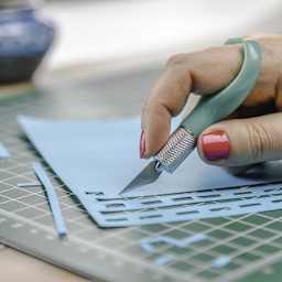 Excel K71 Index Finger Knife - Closeup of person using Knife to cut paper
