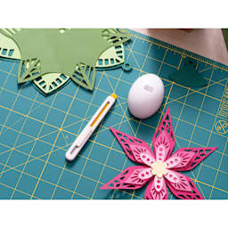 Olfa Beginner Craft Knife Set, knife next to stand on cutting board