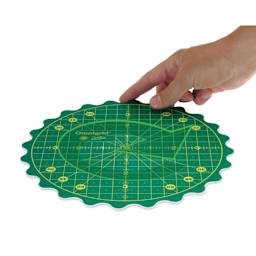 Omnigrid 360 Rotating Cutting Mat - Green/Yellow, 8" - demonstrating rotation