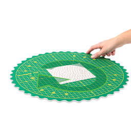 Omnigrid 360 Rotating Cutting Mat - Green/Yellow, 14" - demonstrating rotation