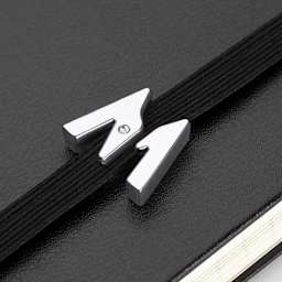 Moleskine Letter Series Notebook Pins, close-up of "M" pin