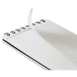 Maruman’s Mnemosyne Reporter Notebook - B7, Black, 3" x 5", sheet being torn from notebook