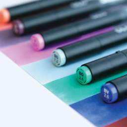 Olo Dual-Tip Markers, clos-up of markers laid out with caps on 