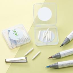 Ohuhu Marker Replacement Tips - Set of 9, on desk with markers