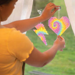 Perler Bead D.I.Y. Tie Dye Suncatcher Activity Kit hanging finished suncatchers