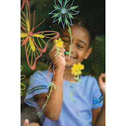 Prang Glass Decor Crayons - Set of 10, child using crayons to draw flowers on glass
