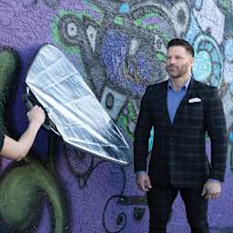 Savage Easy Grip 8-in-1 Reflector Kit reflector in use while shooting with standing subject