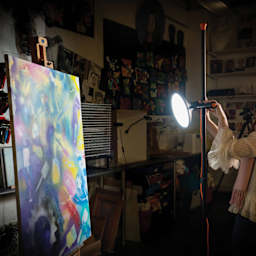 Daylight Artist Studio Lamp 2 with Stand - Chrome and Black in use in painting studio
