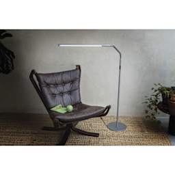 Daylight Slimline 4 LED Floor Lamp - Ice Grey - in use over reading chair