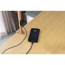 Daylight Slimline 4 LED Table Lamp - Rose Gold - demonstrating device charging capability