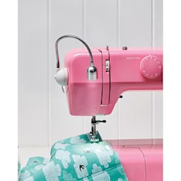 Daylight Sewing Machine Lamp - in use, attached to a pink sewing machine