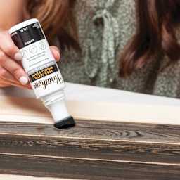 Varathane Less Mess Wood Stain - Ebony stain being applied to wood