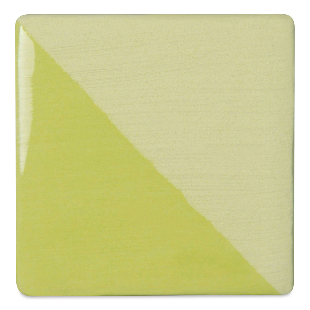 Open in modal - Speedball Ceramic Underglaze - Chartreuse, Opaque, fired on white clay bisque tiles, half covered in Speedball Clear Glaze, fired to cone 05