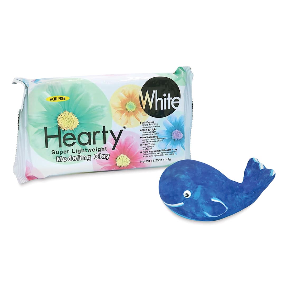 Open in modal - Activa Hearty Clay - Angled view of package with finished and decorated clay whale adjacent
