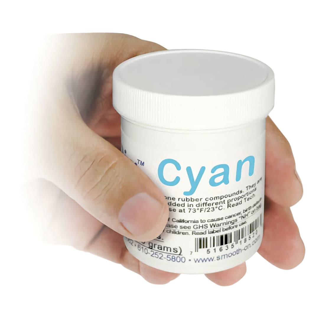 Open in modal - Smooth-On Silc Pig Silicone Color Pigments - Hand holding Single jar of Cyan Pigment shown