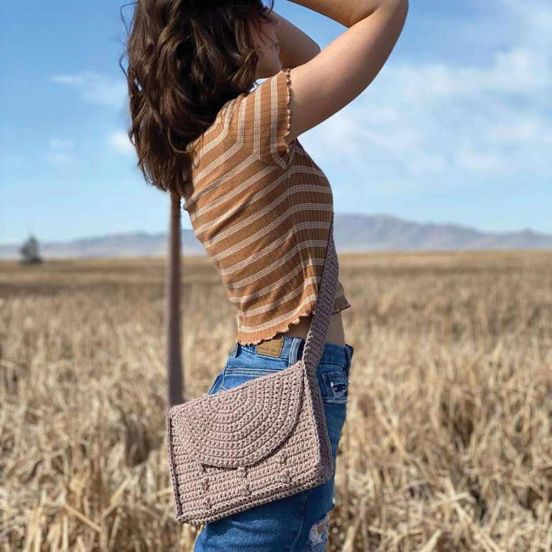 Open in modal - Lion Brand Just Hemp Yarn (Person with sample bag)