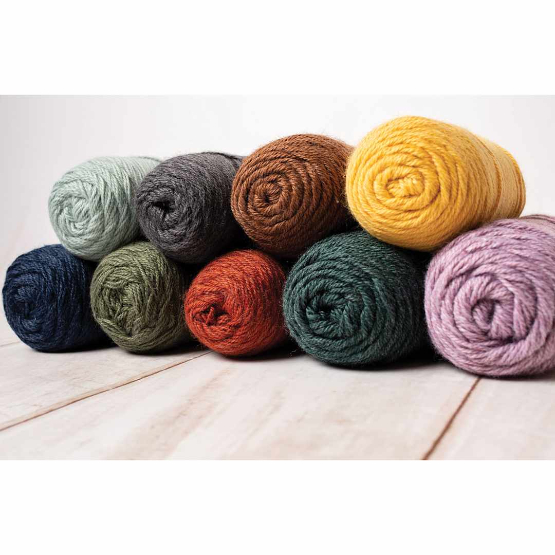 Open in modal - Lion Brand Re-Spun Yarn, rolls on top of each other
