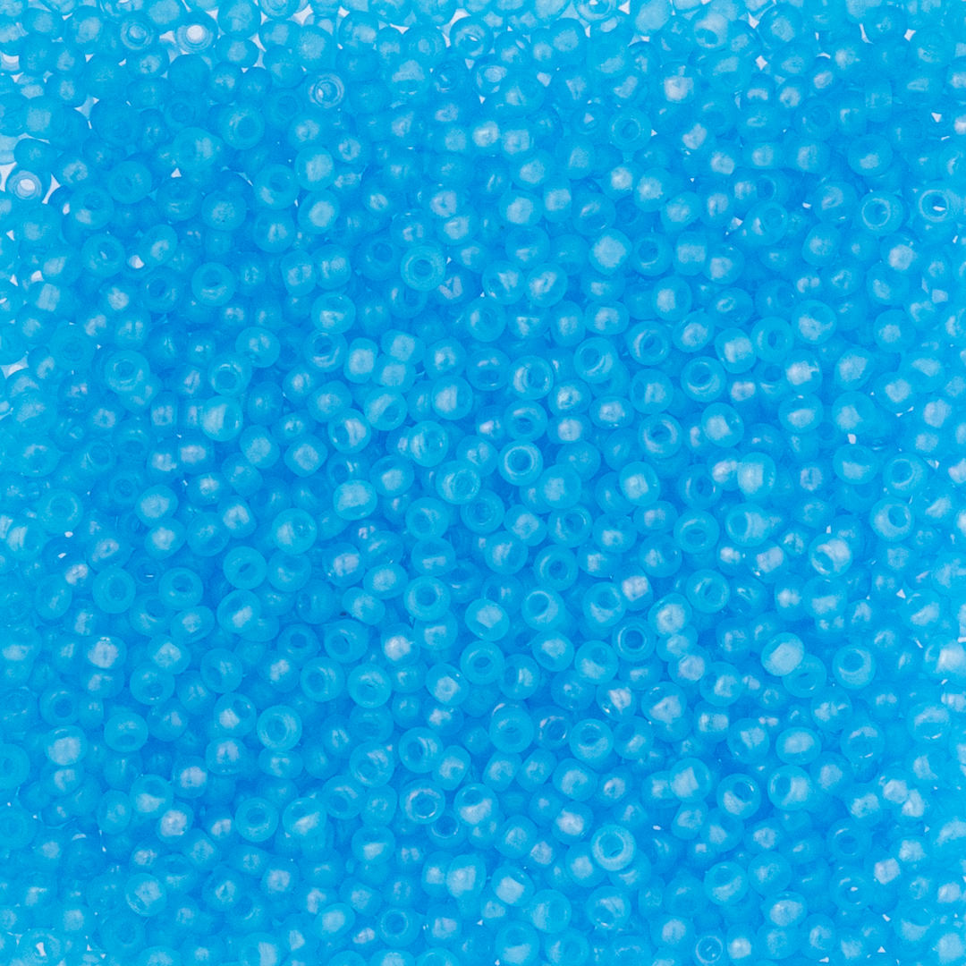 Open in modal - John Bead Czech Glass Seed Beads - Transparent Aqua Rainbow AB, 10/0, 22 g Vial close up