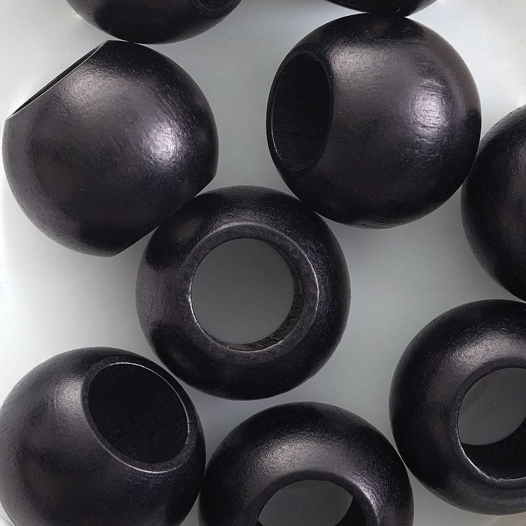 Open in modal - John Bead Euro Wood Beads - Black, Round Large Hole, 20 mm x 16 mm, Pkg of 9 - close-up of beads