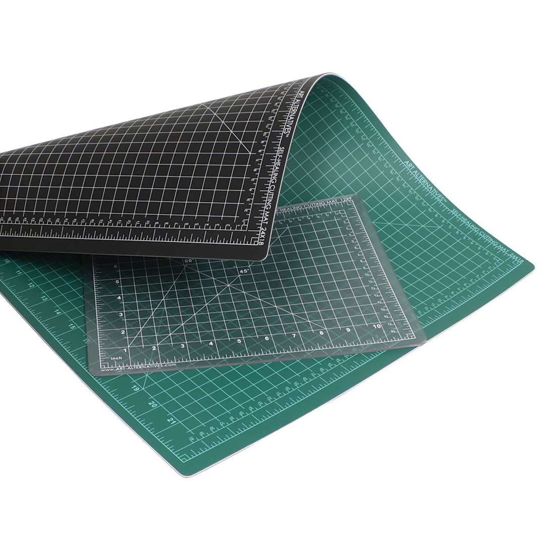 Open in modal - Art Alternatives Self-Healing Cutting Mat - Clear, 9" x 12" on top of black and green mat