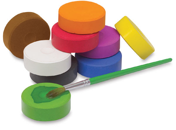 Blick Tempera Cakes- Set of 9 shown with a watercolor brush