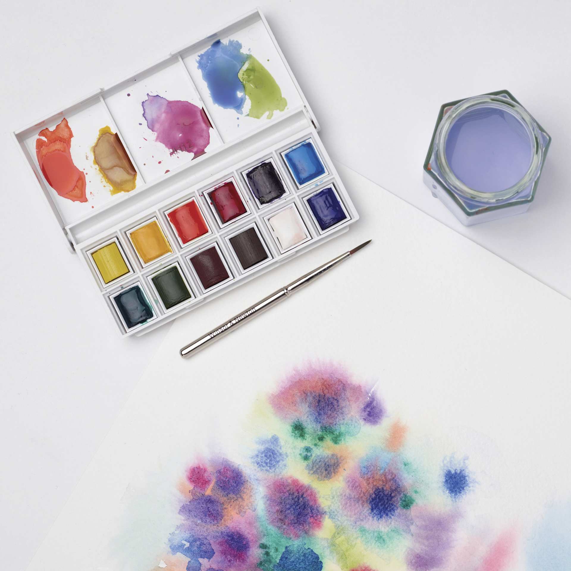 Winsor & Newton Cotman Watercolors - Sketcher's Pocket Set of 12, Assorted Colors, Half Pans, on desk
