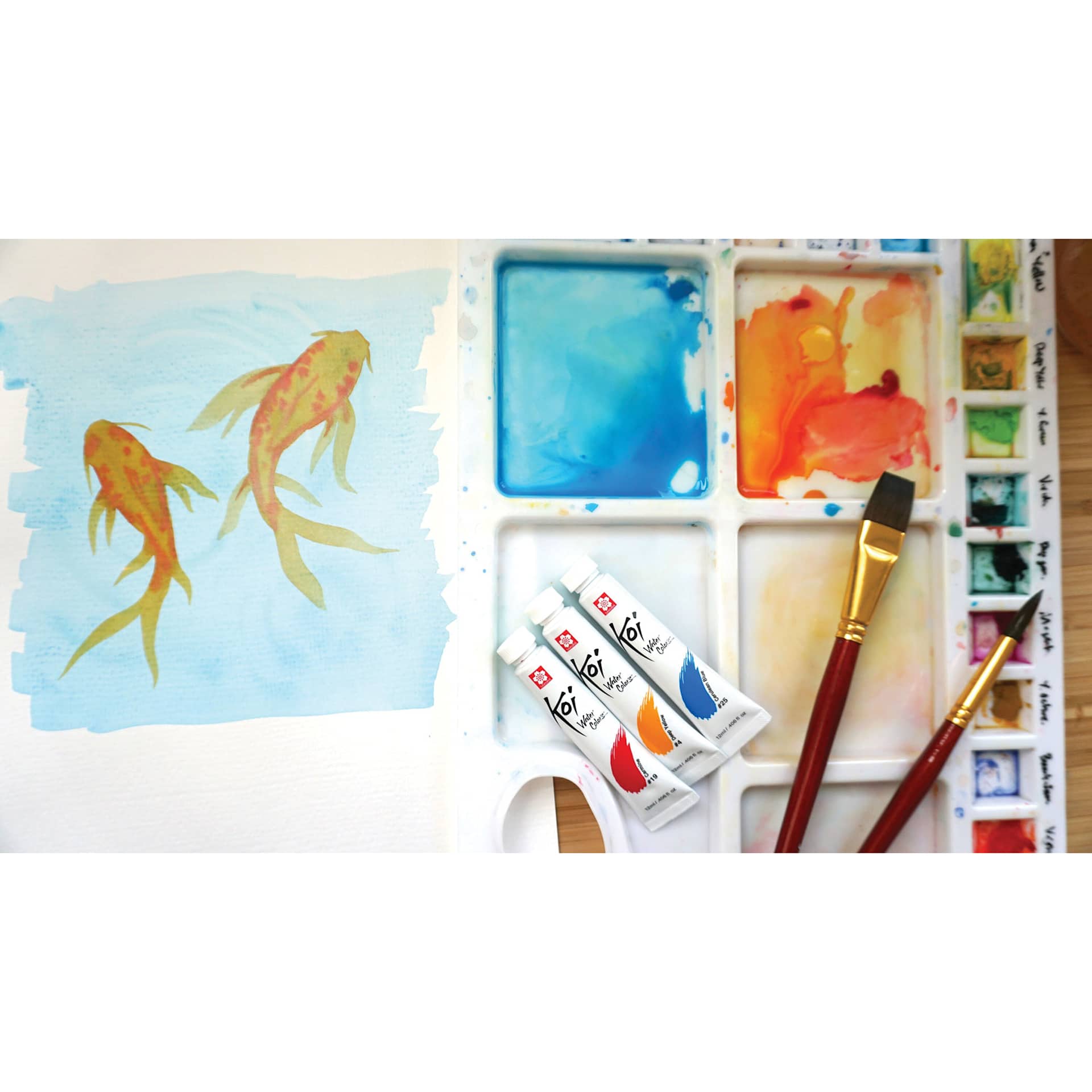 Sakura Koi Watercolor Tubes on a palette with brushes next to a painting. Sakura Koi Watercolor Tubes on a palette with brushes next to a painting.